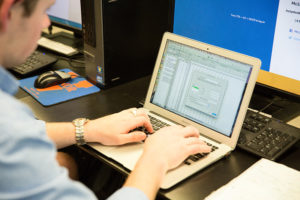 Student performing calculations on computer