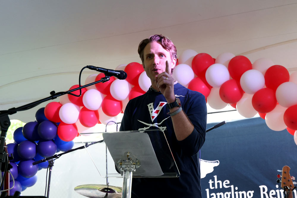 McIntire Professor Jeffrey Lovelace has developed a bond with DeSorbo that was ignited after the swim coach spoke to his students about leadership. (Photo by Matt Riley, University Communications)
