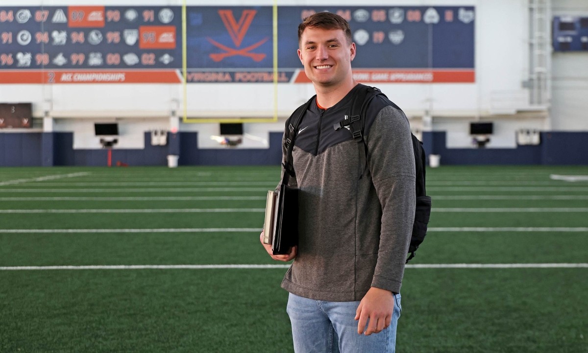 Trey McDonald posing on a football field