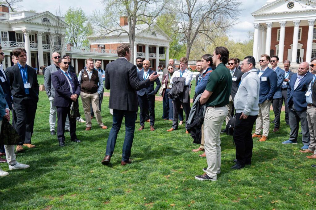 Members of the Ivy League Veterans Council listen during Nelson’s architectural tour of the Academic Village. About 40 of the council’s members attended a conference on Grounds last month. (Photo by Mike Mather, University Communications)