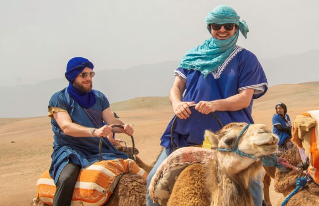 M.S. in Commerce students on the European and North African track take a camel ride. (Photo courtesy of Ira Harris)