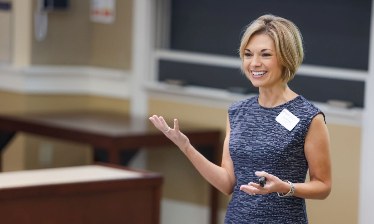 Jill Mitchell teaching at the front of a classroom