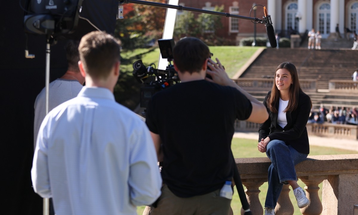 Jackie Eng sitting while filming a video