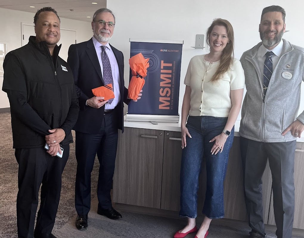 Jamal Wade (M.S. in MIT ’26), Professor Stefano Grazioli, Booz Allen Principal Jessica Reinhardt (M.S. in MIT ’19), and Booz Allen Lead Associate Franz Lopez (M.S. in MIT ’26). Reinhardt served as the Module 3 Panel Executive for Wade’s team.