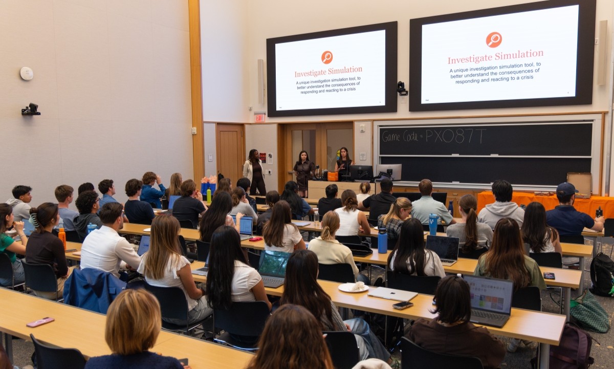 students listening to pwc representatives during the pwc Investigate event