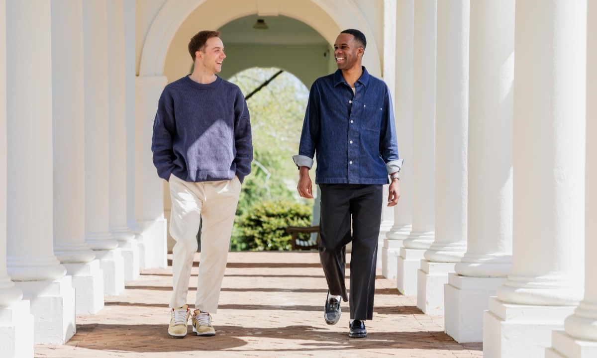 Bryan Pollard and Jordon Durst talking and walking down colonnade