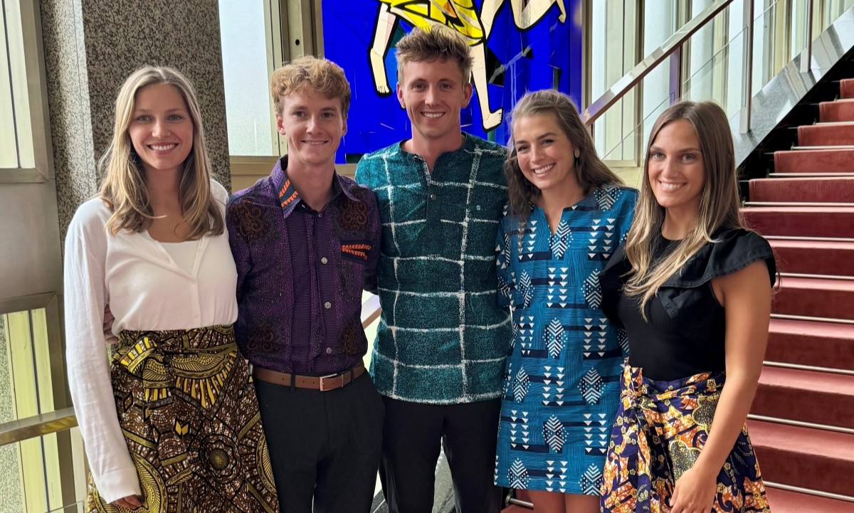 5 students smiling at the camera