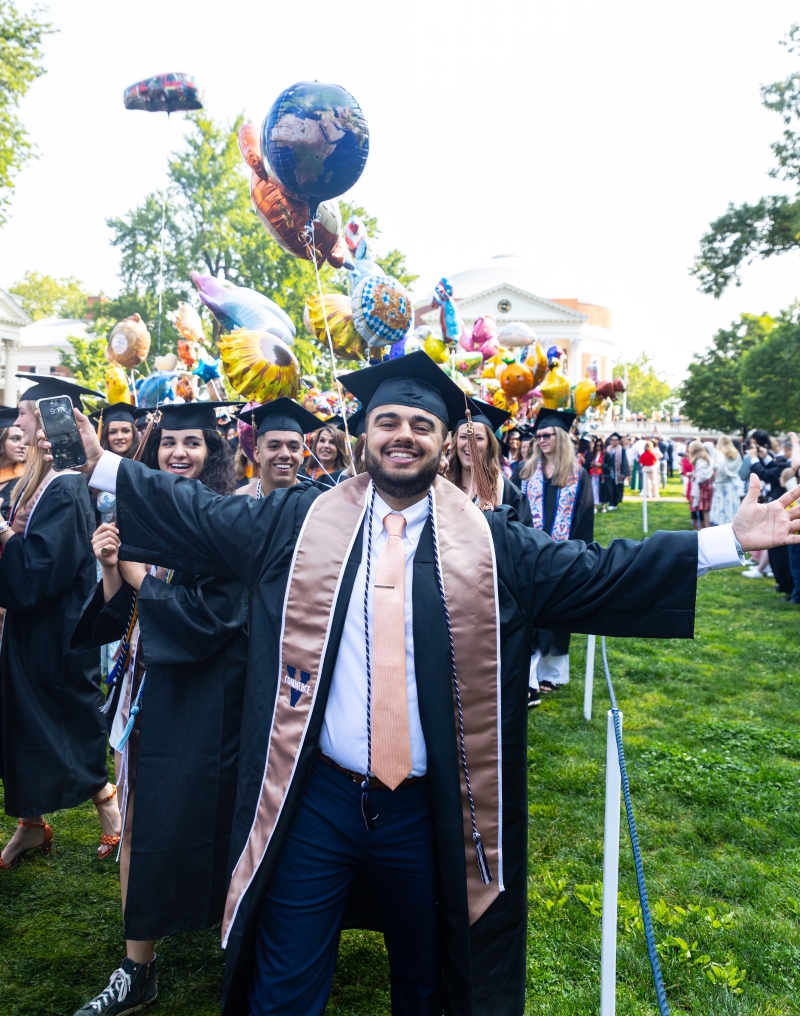 Azzaam Kadapia at UVA graduation, wearing a cap and gown